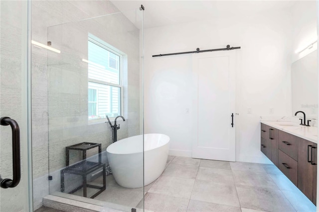 bathroom with vanity, tile patterned flooring, and shower with separate bathtub