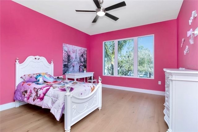 bedroom featuring light hardwood / wood-style flooring and ceiling fan