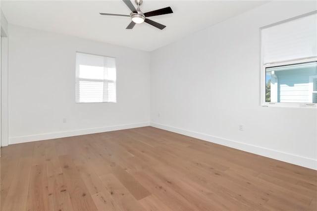 unfurnished room with hardwood / wood-style floors and ceiling fan