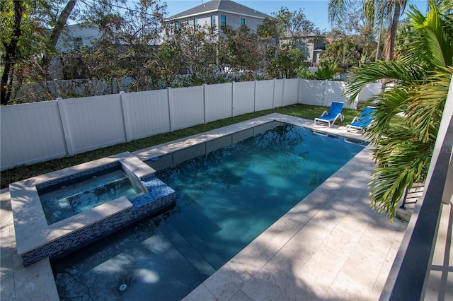 view of swimming pool with an in ground hot tub