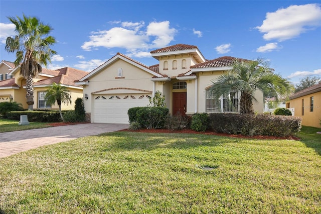 mediterranean / spanish-style home featuring a garage and a front lawn