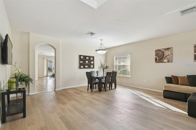 dining area featuring light wood-type flooring