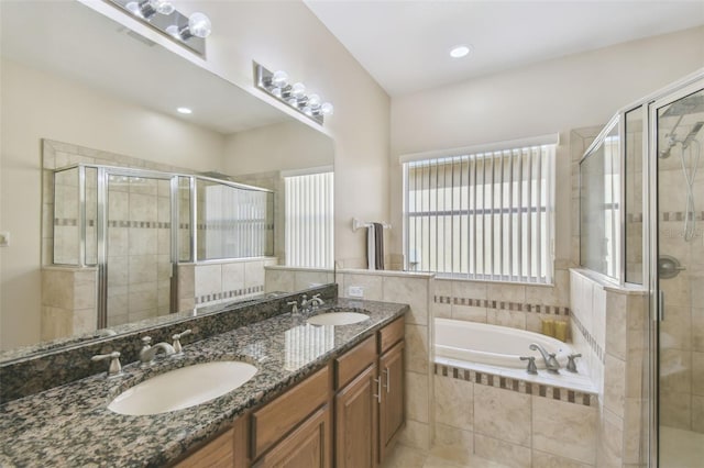 bathroom with plus walk in shower and vanity