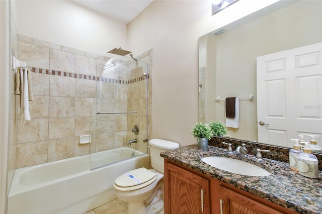 full bathroom with tiled shower / bath combo, vanity, tile patterned flooring, and toilet