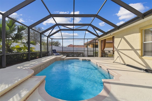 view of pool featuring a lanai and a patio