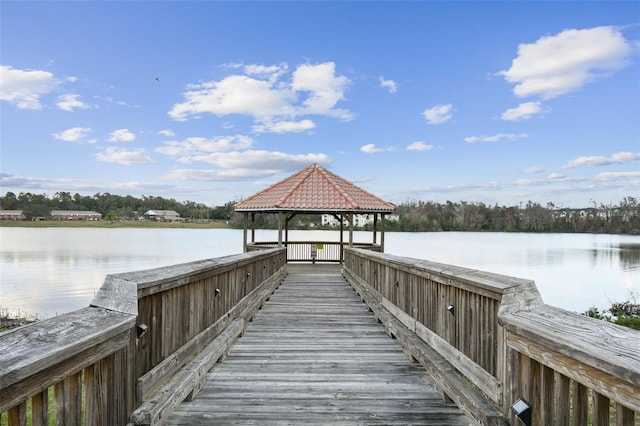 view of dock featuring a gazebo and a water view