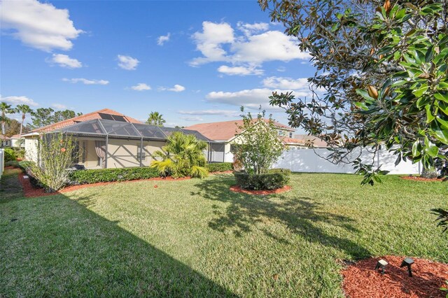 view of yard featuring a lanai