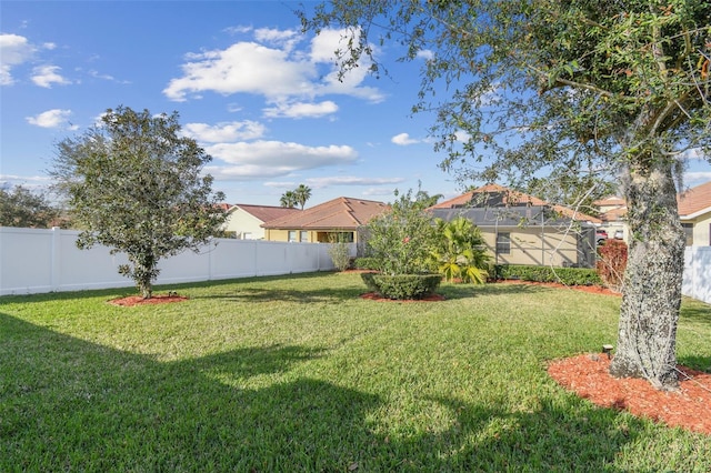 view of yard featuring a lanai