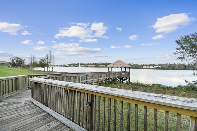 view of dock featuring a gazebo and a water view