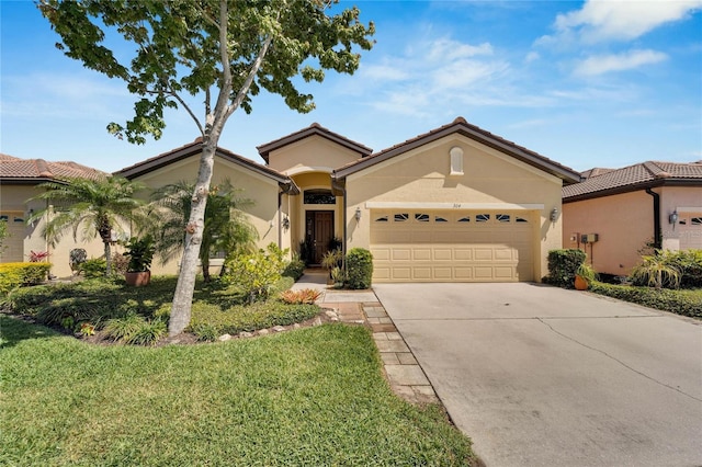 mediterranean / spanish-style home featuring a garage and a front lawn