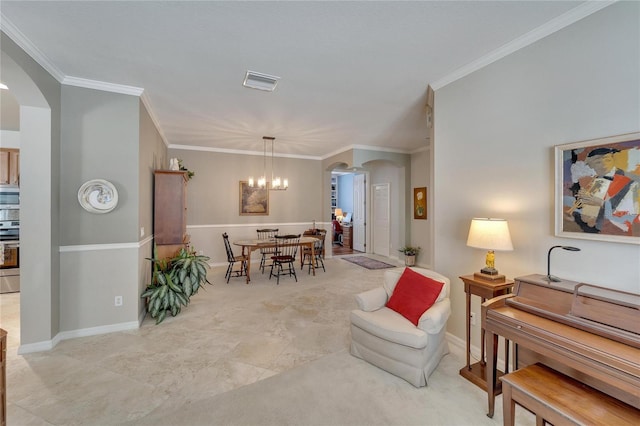 living room featuring an inviting chandelier and ornamental molding