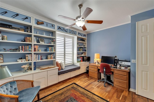 office featuring hardwood / wood-style flooring, ornamental molding, and ceiling fan