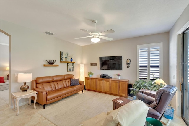 living room featuring ceiling fan