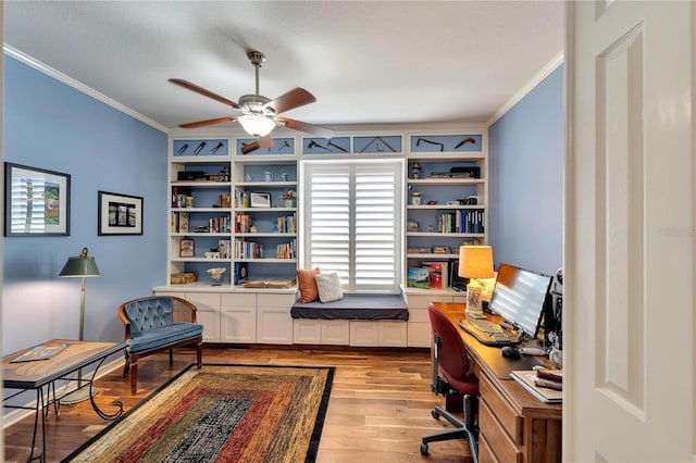 office featuring ornamental molding, ceiling fan, and light wood-type flooring