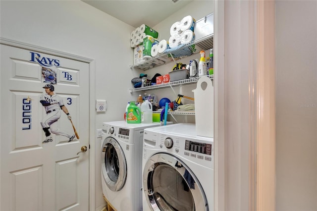 laundry room with washing machine and clothes dryer