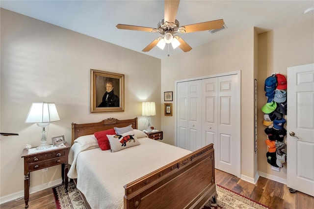 bedroom featuring dark hardwood / wood-style floors, ceiling fan, and a closet