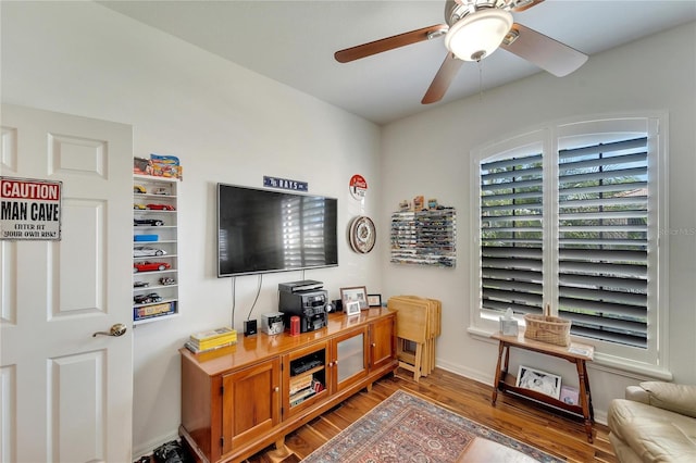 interior space featuring hardwood / wood-style floors and ceiling fan