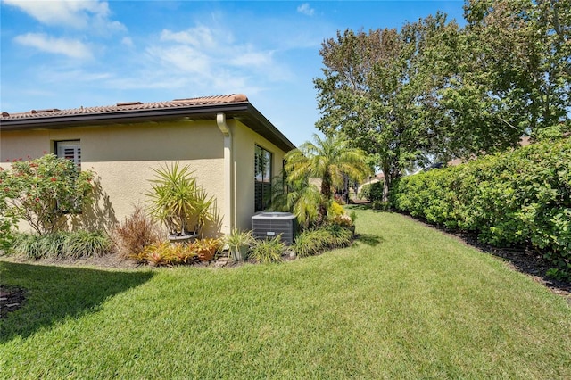 view of yard featuring central AC