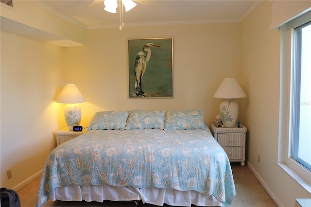 tiled bedroom with crown molding and multiple windows