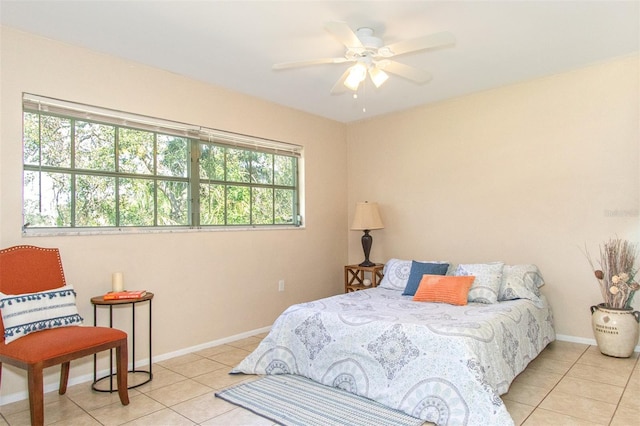 tiled bedroom with ceiling fan