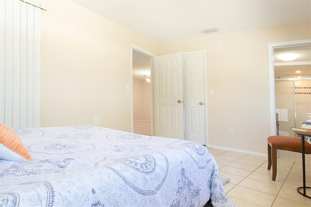 bedroom featuring light tile patterned flooring