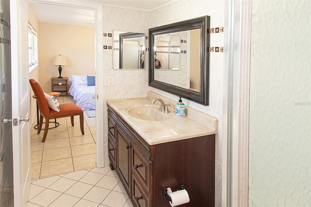 bathroom with vanity, tile patterned flooring, and ornamental molding