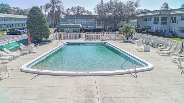 view of swimming pool with a patio