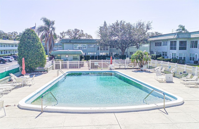 view of swimming pool with a patio