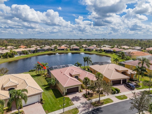 birds eye view of property featuring a water view and a residential view