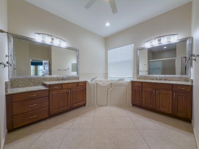 full bath featuring a sink, a garden tub, tile patterned flooring, a shower stall, and a wealth of natural light