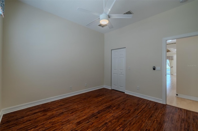 interior space featuring ceiling fan, wood finished floors, visible vents, and baseboards