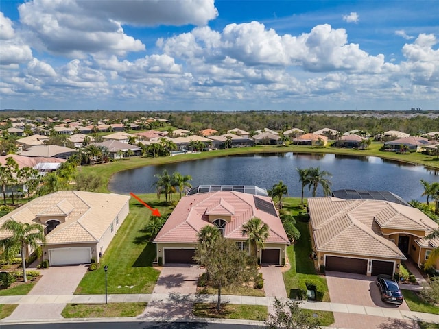 birds eye view of property with a water view and a residential view