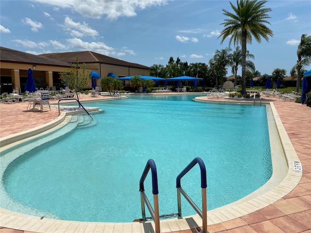 community pool with a patio area