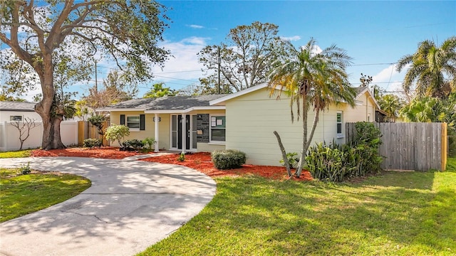 ranch-style home with a front yard