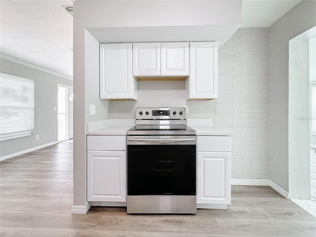 kitchen with white cabinetry, ornamental molding, light hardwood / wood-style flooring, and electric range