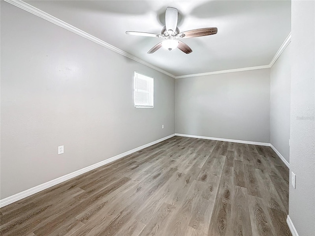 spare room with crown molding, hardwood / wood-style floors, and ceiling fan