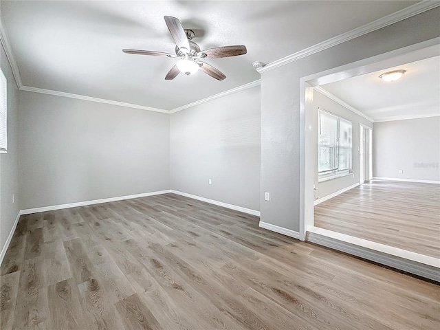 spare room with ceiling fan, crown molding, and light wood-type flooring