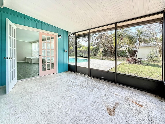 unfurnished sunroom featuring french doors and a healthy amount of sunlight