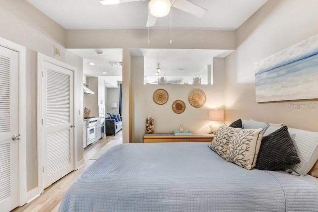 bedroom with ceiling fan and light wood-type flooring