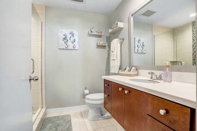 bathroom featuring vanity, an enclosed shower, tile patterned floors, and toilet