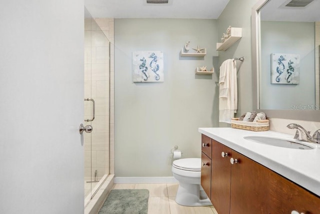 bathroom featuring tile patterned floors, toilet, an enclosed shower, and vanity