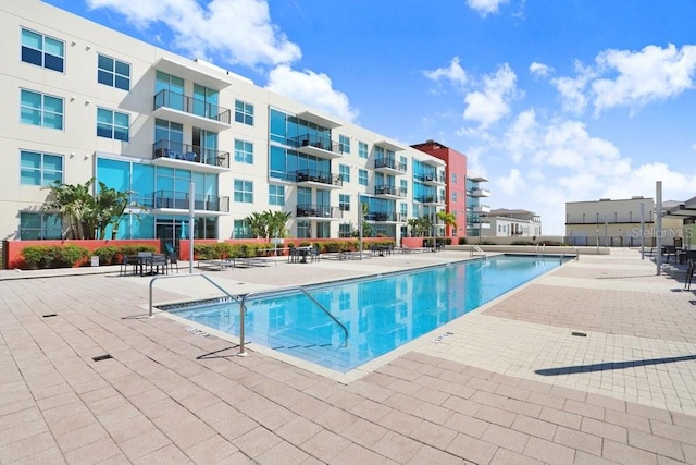 view of swimming pool featuring a patio area