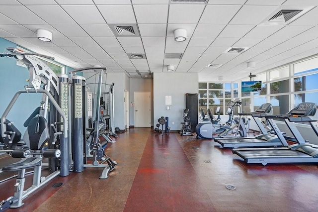 exercise room featuring a paneled ceiling