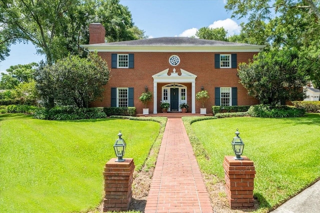 colonial home with a front yard