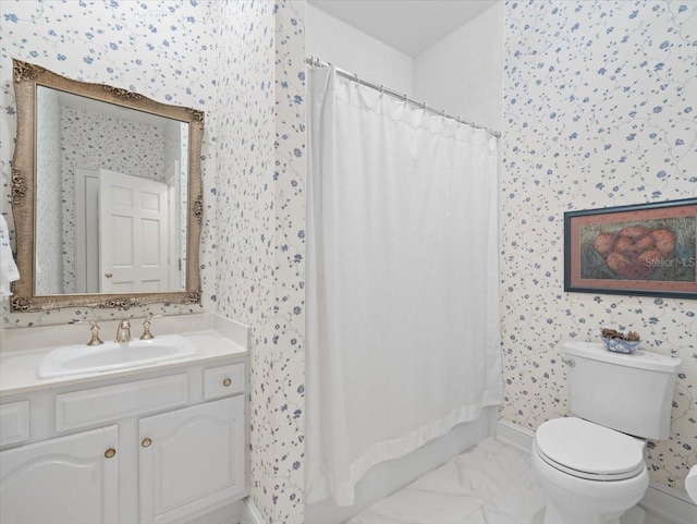 bathroom featuring vanity and toilet