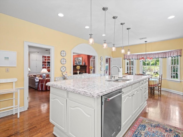 kitchen with white cabinetry, sink, pendant lighting, and dishwasher