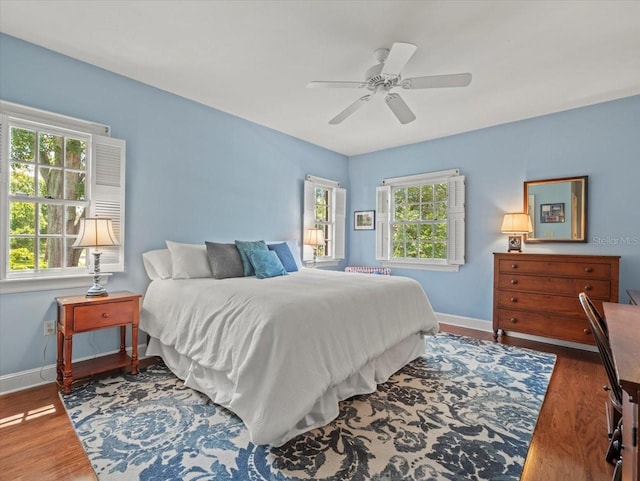 bedroom featuring ceiling fan and dark hardwood / wood-style flooring