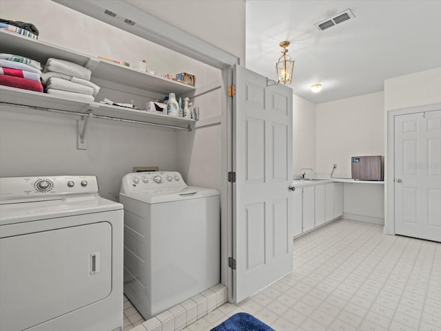 laundry room with washer and dryer