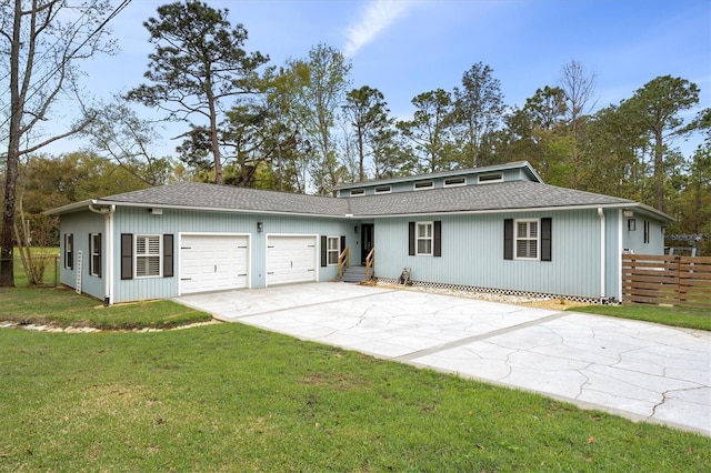 single story home with a garage and a front yard