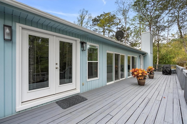 wooden deck featuring french doors